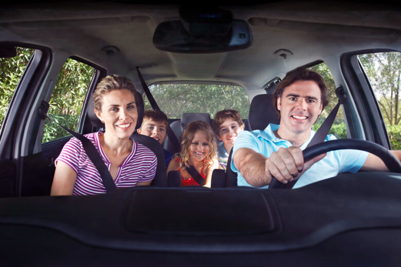 Family in the car with Cheapest car insurance in Burlington